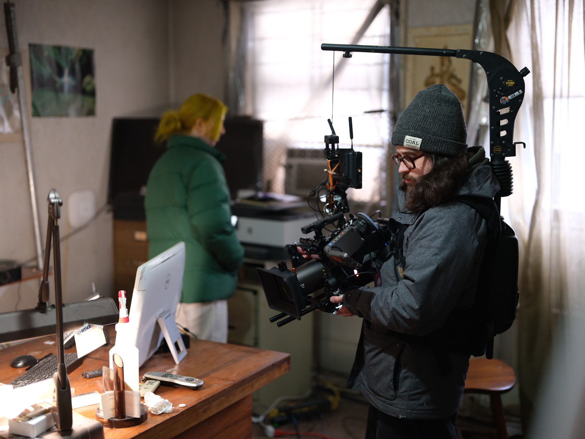 Camera department building the rig on set