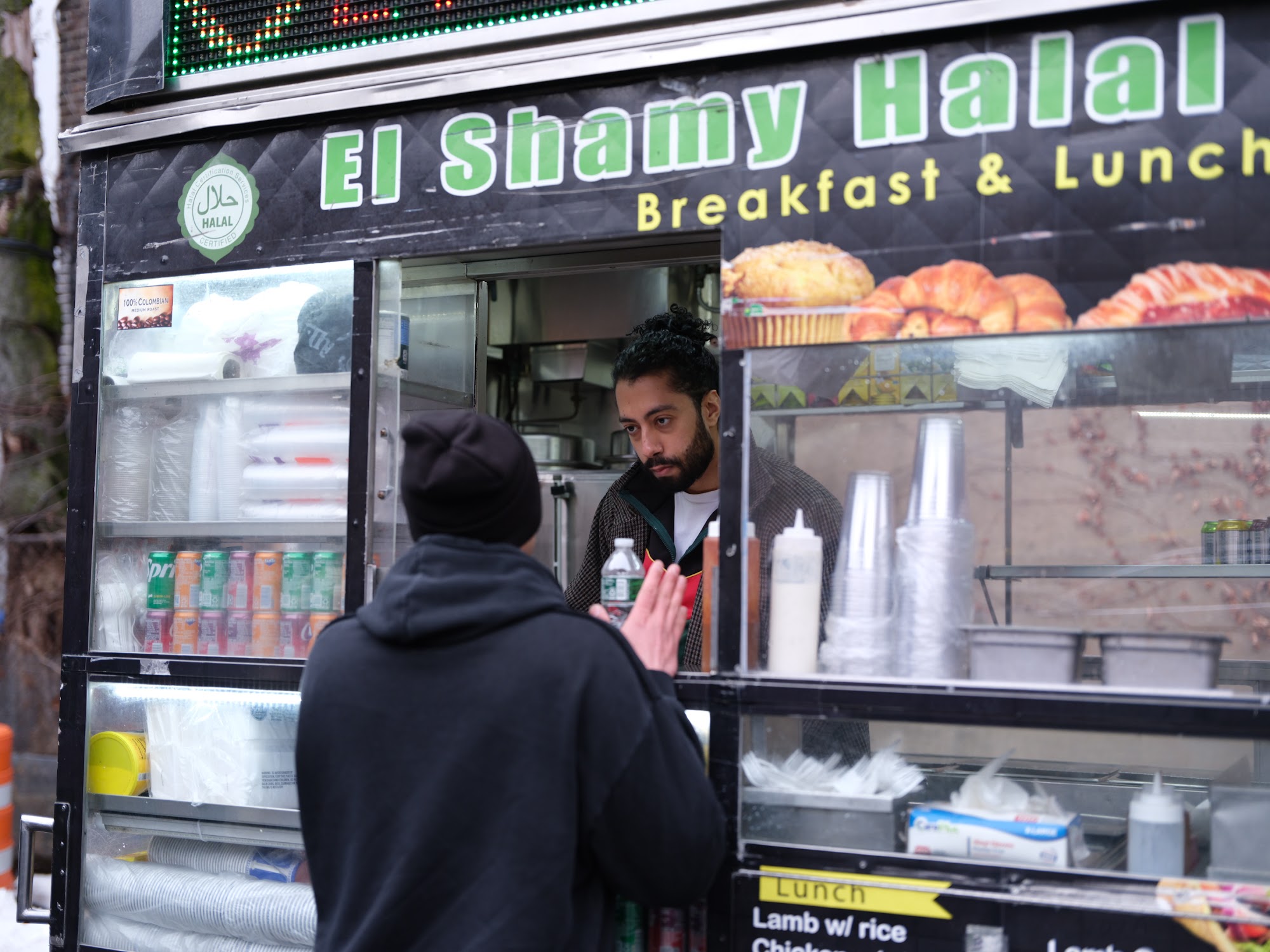 Service at the halal cart window during production